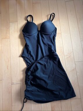 Pepper Prow Swim black bathing suit and matching cover-up skirt.